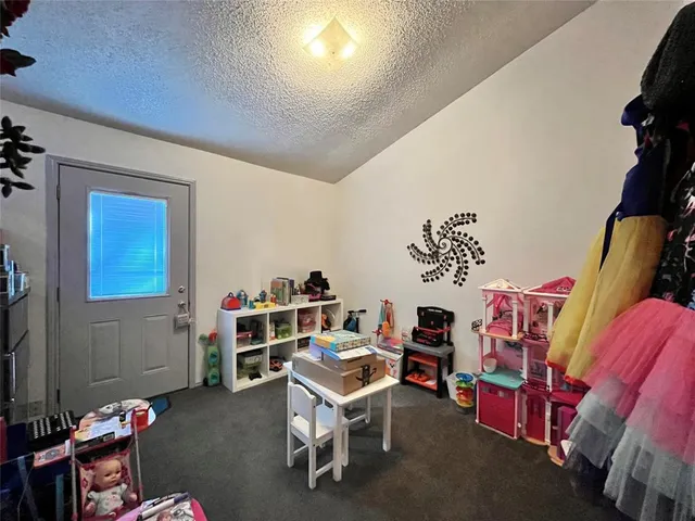 a room with furniture and a wooden floor