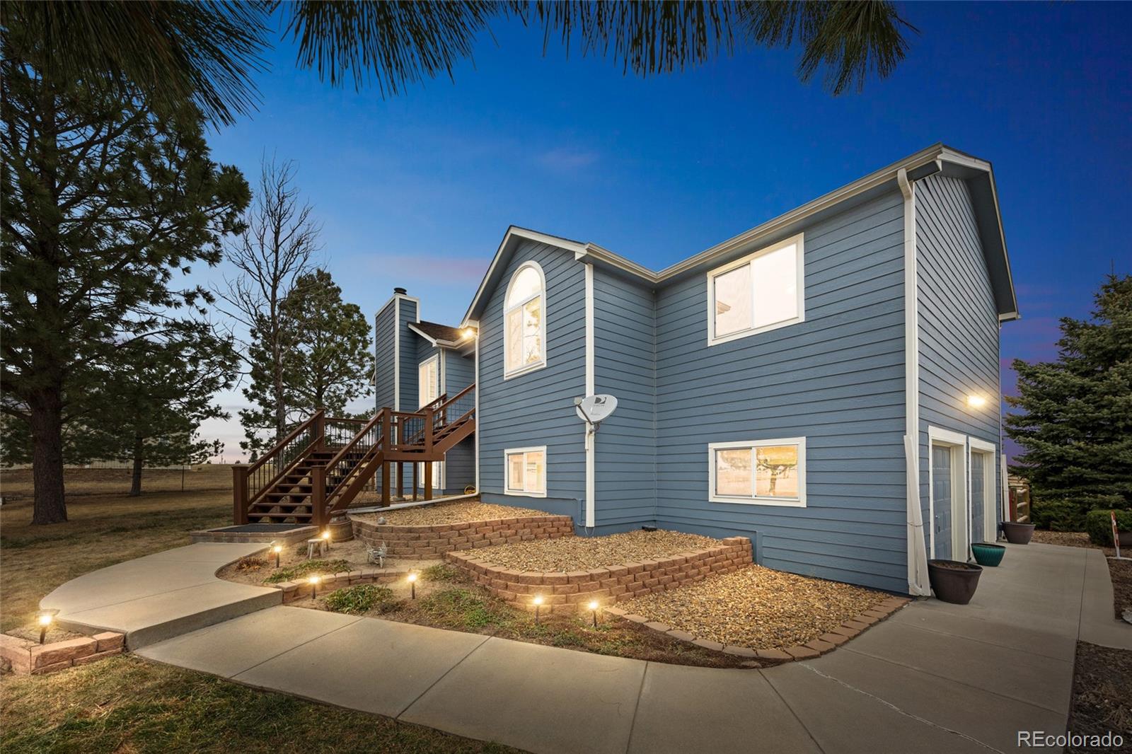 42865 Vista Ridge Road Parker, CO 80138 - Photo 2 of 50 a view of a house with a yard