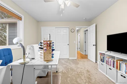 a view of a dining room with furniture and a chandelier