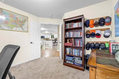 a view of a workspace with furniture and toys
