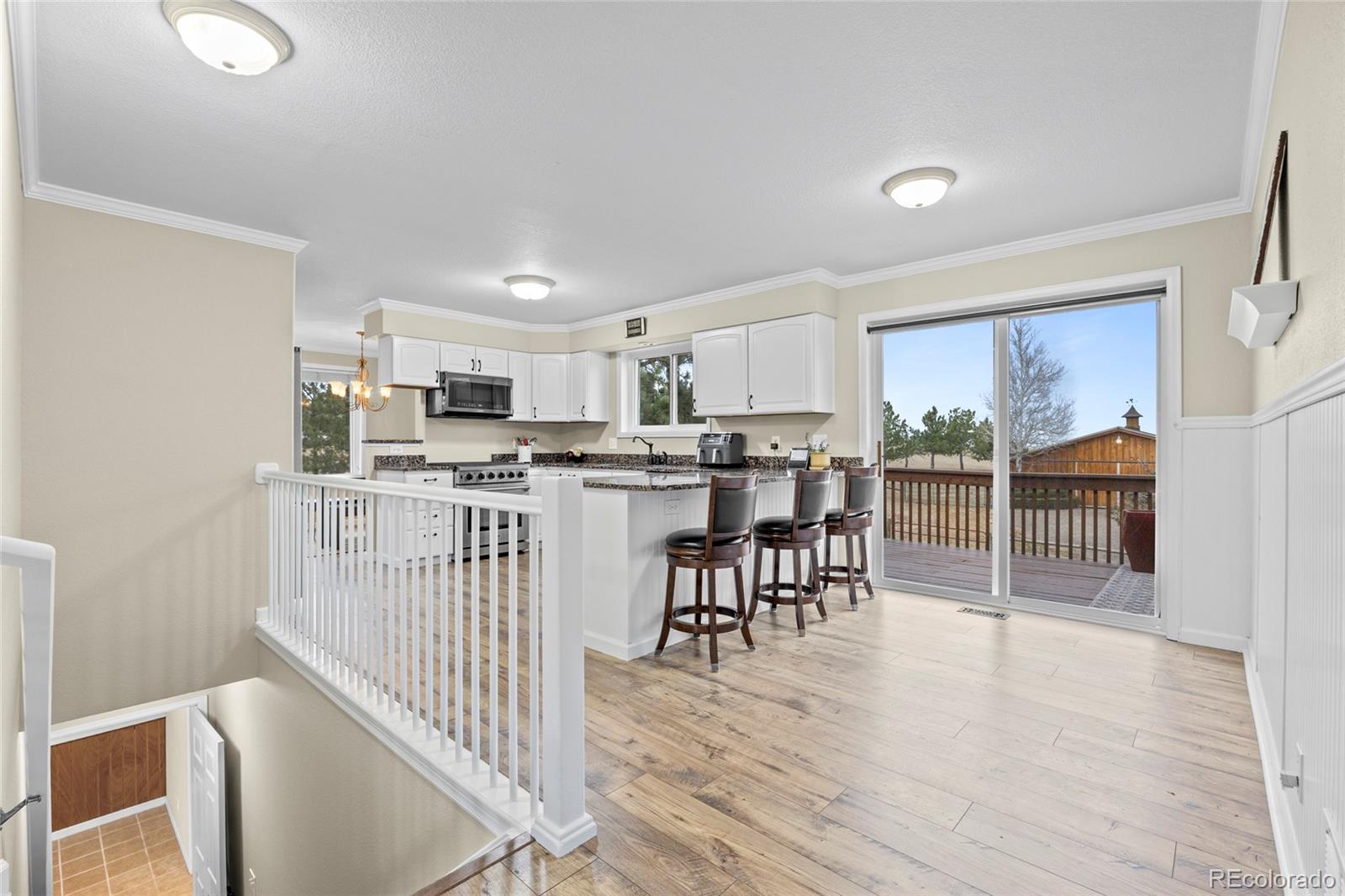 42865 Vista Ridge Road Parker, CO 80138 - Photo 28 of 50 a view of a kitchen and dining room
