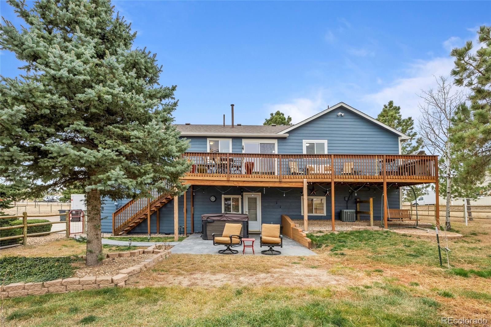 42865 Vista Ridge Road Parker, CO 80138 - Photo 38 of 50 a front view of a house with a yard and seating space