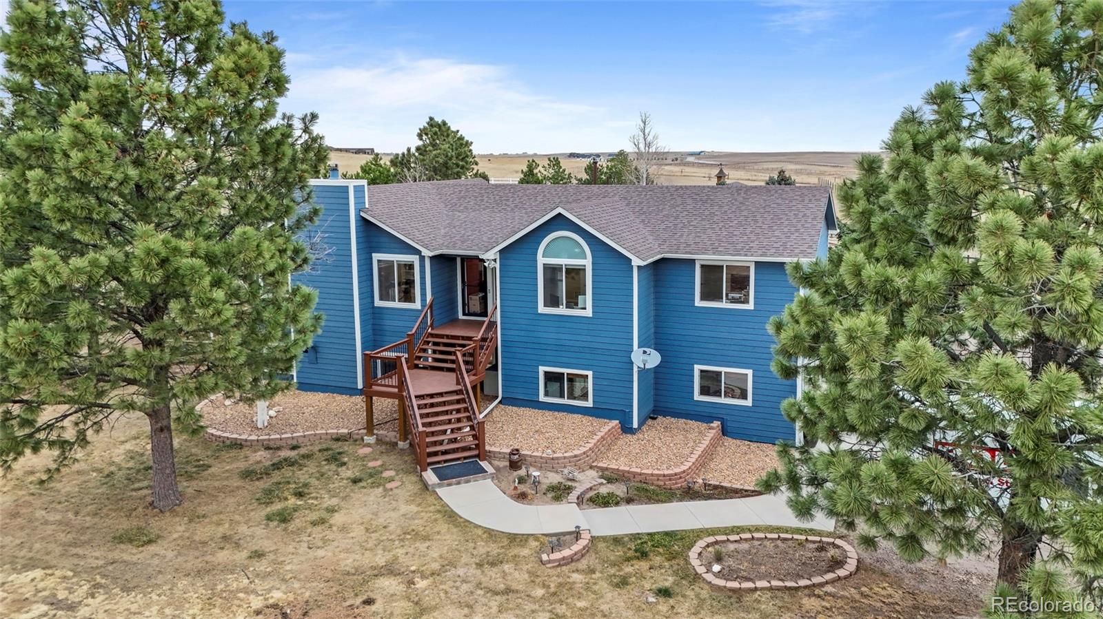 42865 Vista Ridge Road Parker, CO 80138 - Photo 4 of 50 a front view of a house with a yard