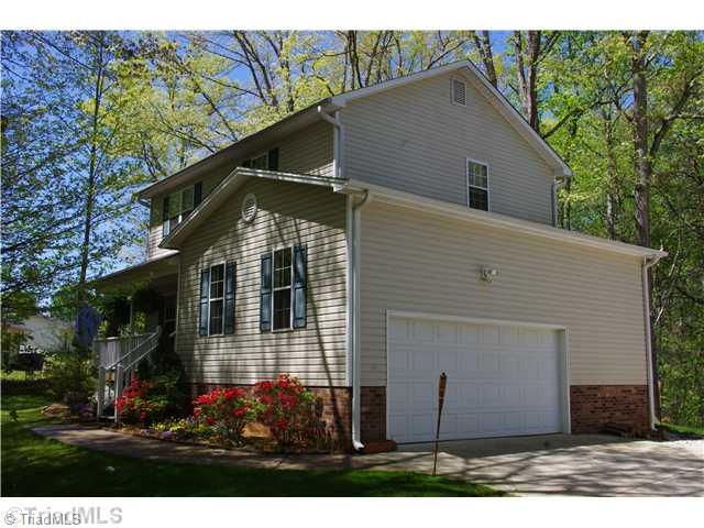 3525 Baxter Road Southeast Winston-Salem, NC 27107 - Photo 3 of 16 Exterior Front. Great Oversized Side entry 2 car garage. To the right in the garage is a great work bench area.