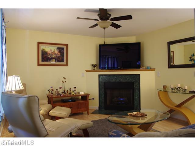 3525 Baxter Road Southeast Winston-Salem, NC 27107 - Photo 7 of 16 Living Room. Laminate Floors in this great living room with a gas fireplace.