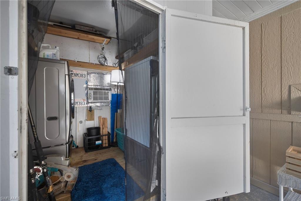 777 Walkerbilt Road, Unit 34 Naples, FL 34110 - Photo 15 of 23 Laundry Room Outside