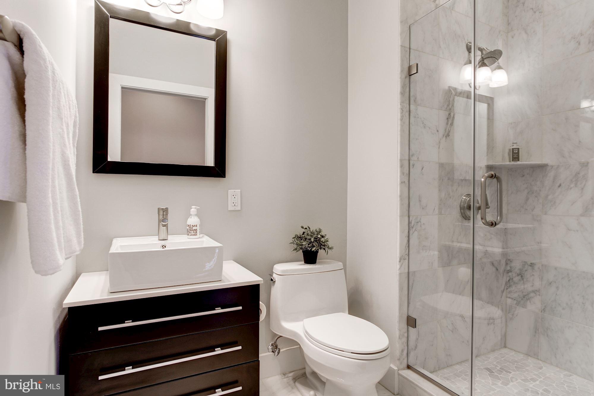 762 Park Road Northwest, Unit 7 Washington, DC 20010 - Photo 15 of 18 Marble-Tiled Guest Bath