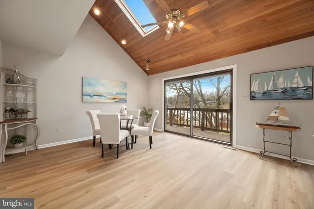 a kitchen with stainless steel appliances kitchen island granite countertop a refrigerator and a sink