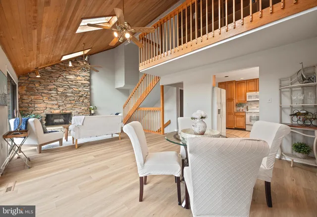 a kitchen with a sink window and cabinets