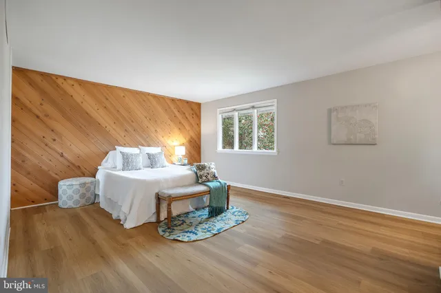 a view of a dining room with furniture wooden floor and chandelier