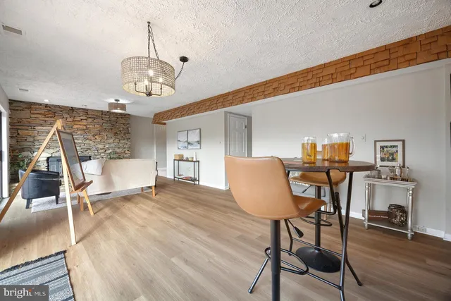 a view of a house with backyard and porch