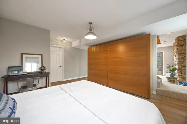 a view of swimming pool with garden and trees