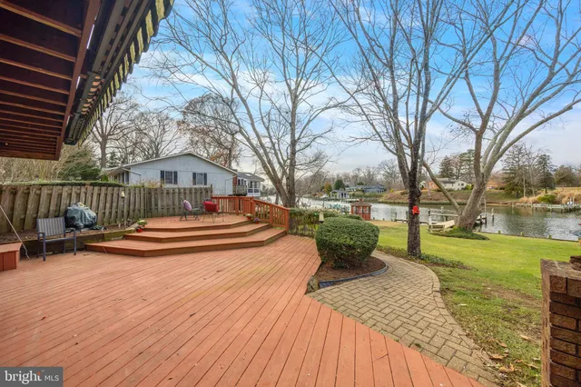 an aerial view of a house with lake view