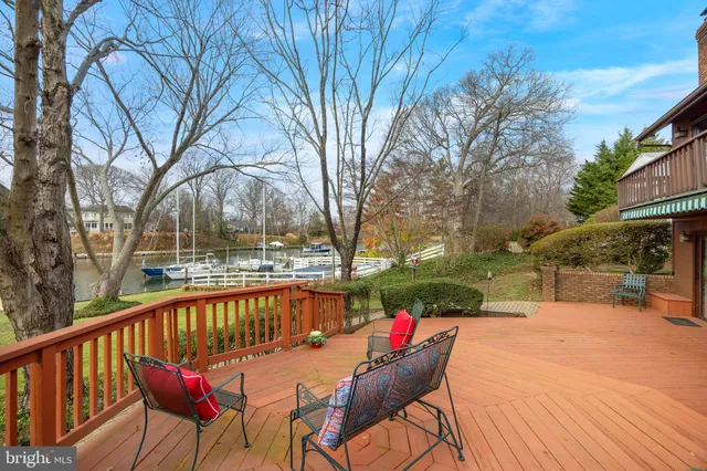 an aerial view of a house with outdoor space and a lake view