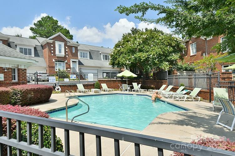 4939 South Hill View Drive Charlotte, NC 28210 - Photo 24 of 24 a view of a house with swimming pool and sitting area