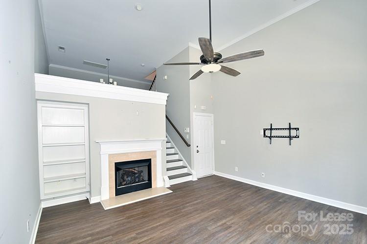 4939 South Hill View Drive Charlotte, NC 28210 - Photo 5 of 24 a view of a livingroom with wooden floor a fireplace