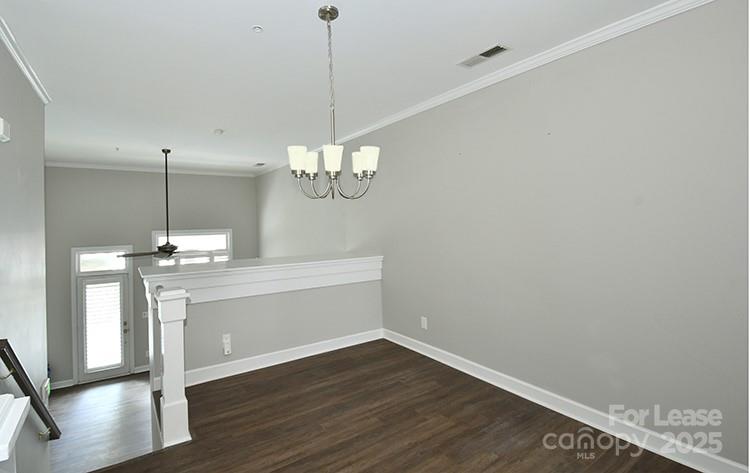 4939 South Hill View Drive Charlotte, NC 28210 - Photo 7 of 24 a view of a room with wooden floor and chandelier
