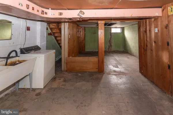 a view of a bathroom with a sink and mirror