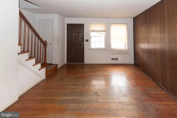 a view of entryway with wooden floor