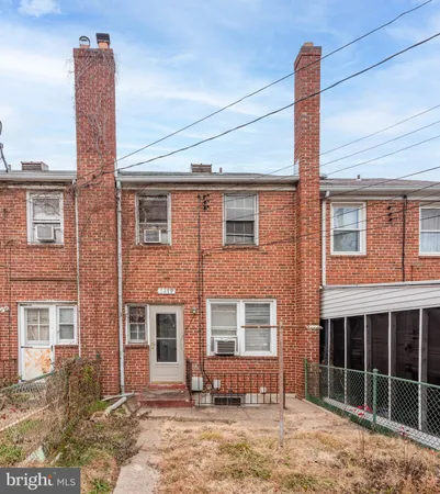 a view of a water fountain in front of buildings