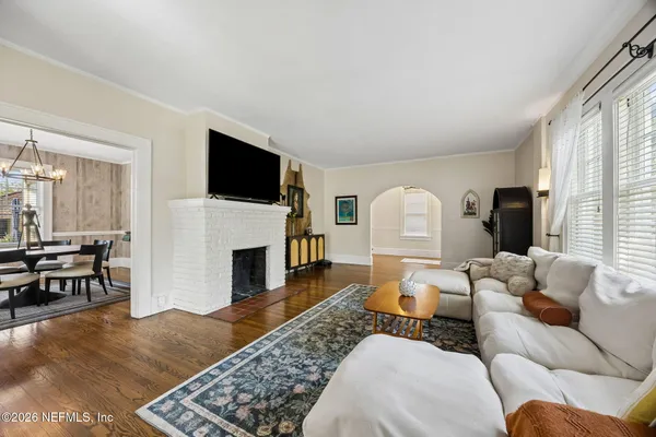 a living room with furniture and windows