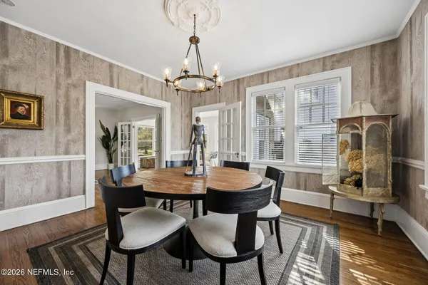a kitchen with stainless steel appliances granite countertop a stove and white cabinets