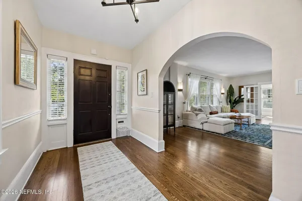 a living room with furniture fireplace and flat screen tv