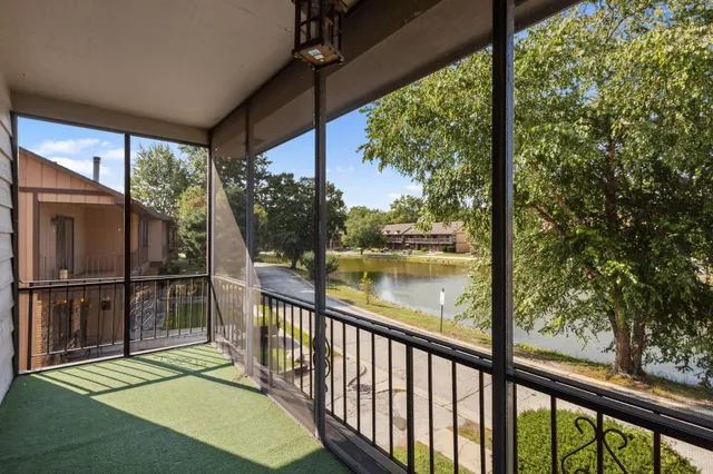 a view of a balcony with lake view