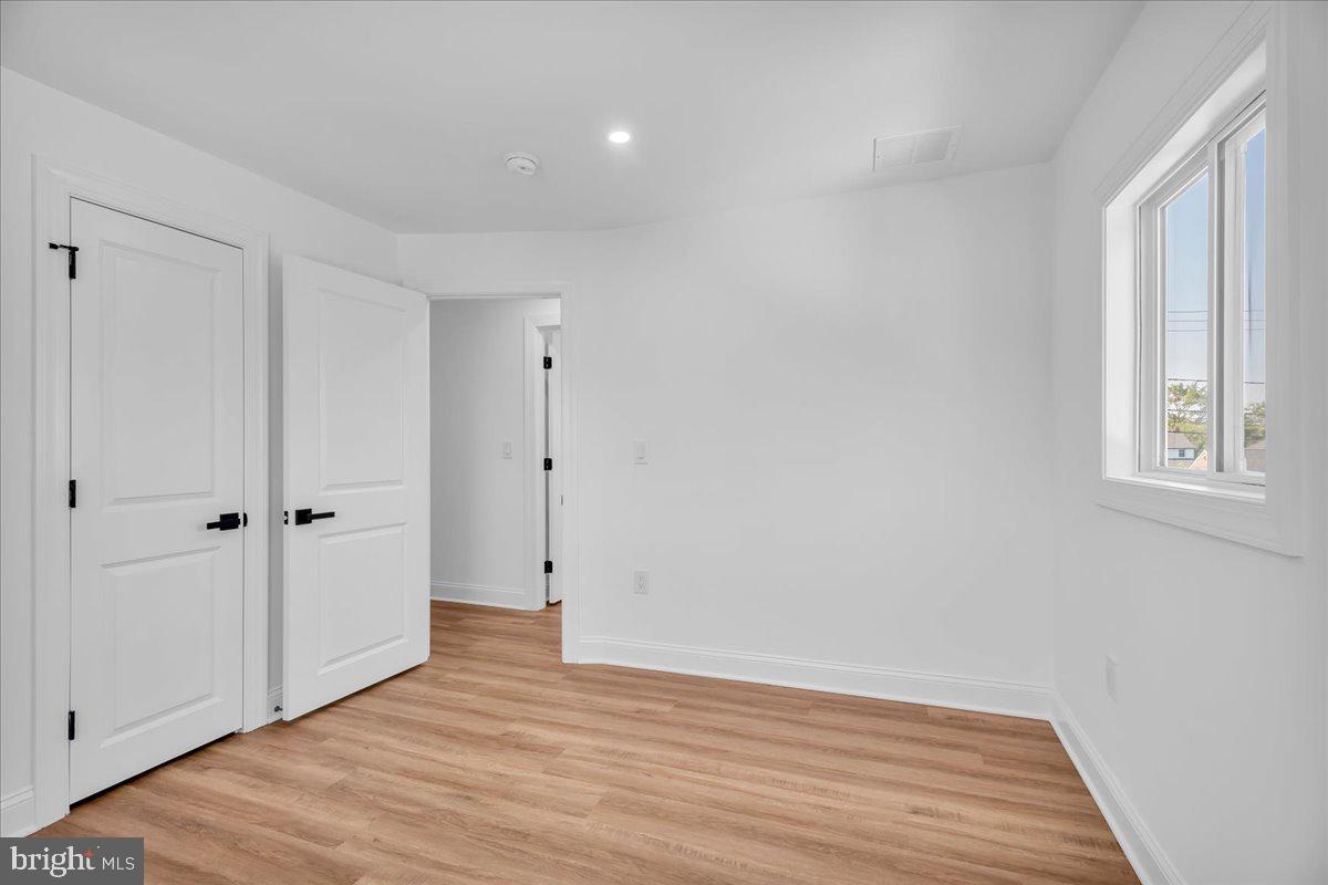 2504 Church Road Cinnaminson, NJ 08077 - Photo 43 of 79 a view of an empty room with wooden floor and a window