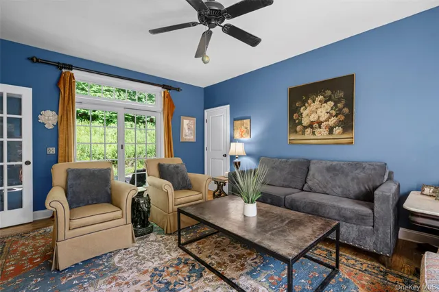 a kitchen with stainless steel appliances granite countertop a table chairs sink and cabinets