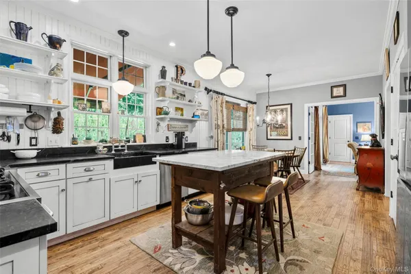a large kitchen with a table and chairs