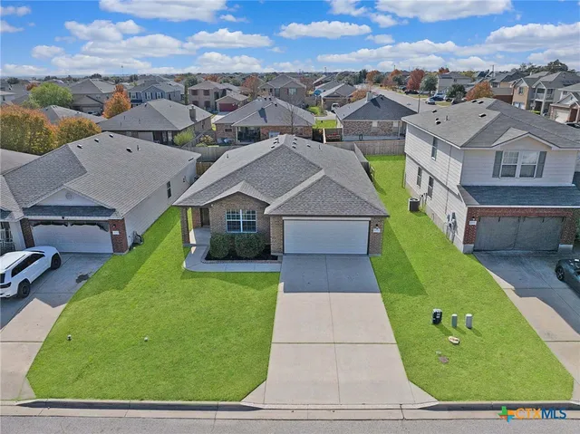 an aerial view of a house with a garden