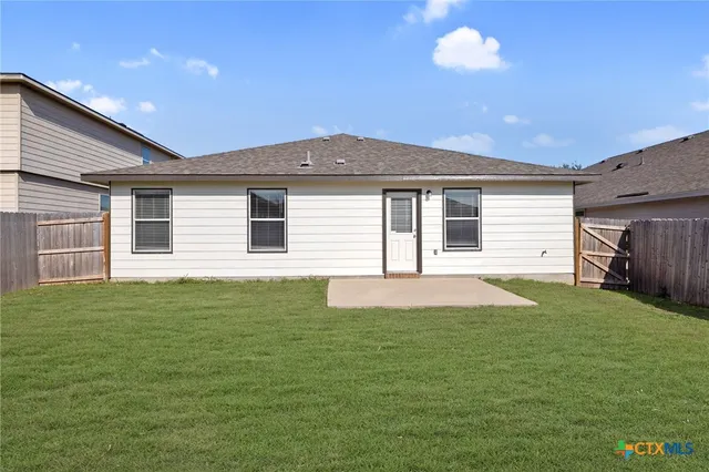 a house view with a backyard space