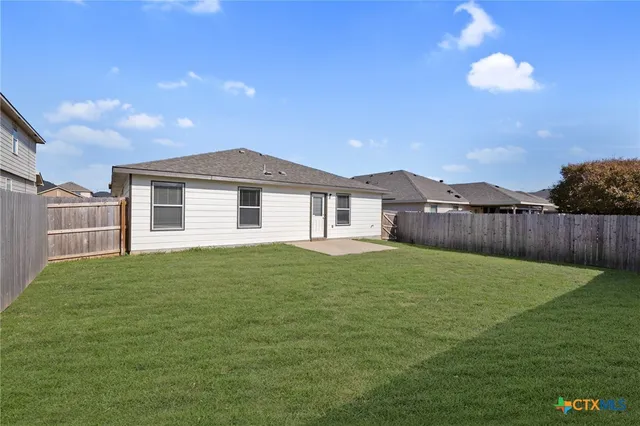 a house view with a garden space