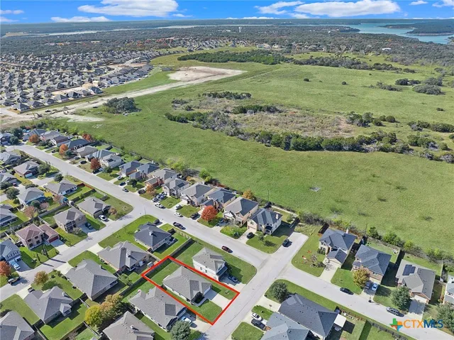 an aerial view of a house with a garden