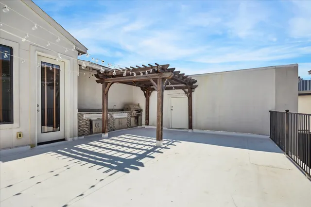 a living room with furniture flowerpot and wooden floor