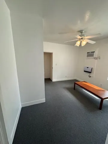 an empty room with wooden floor