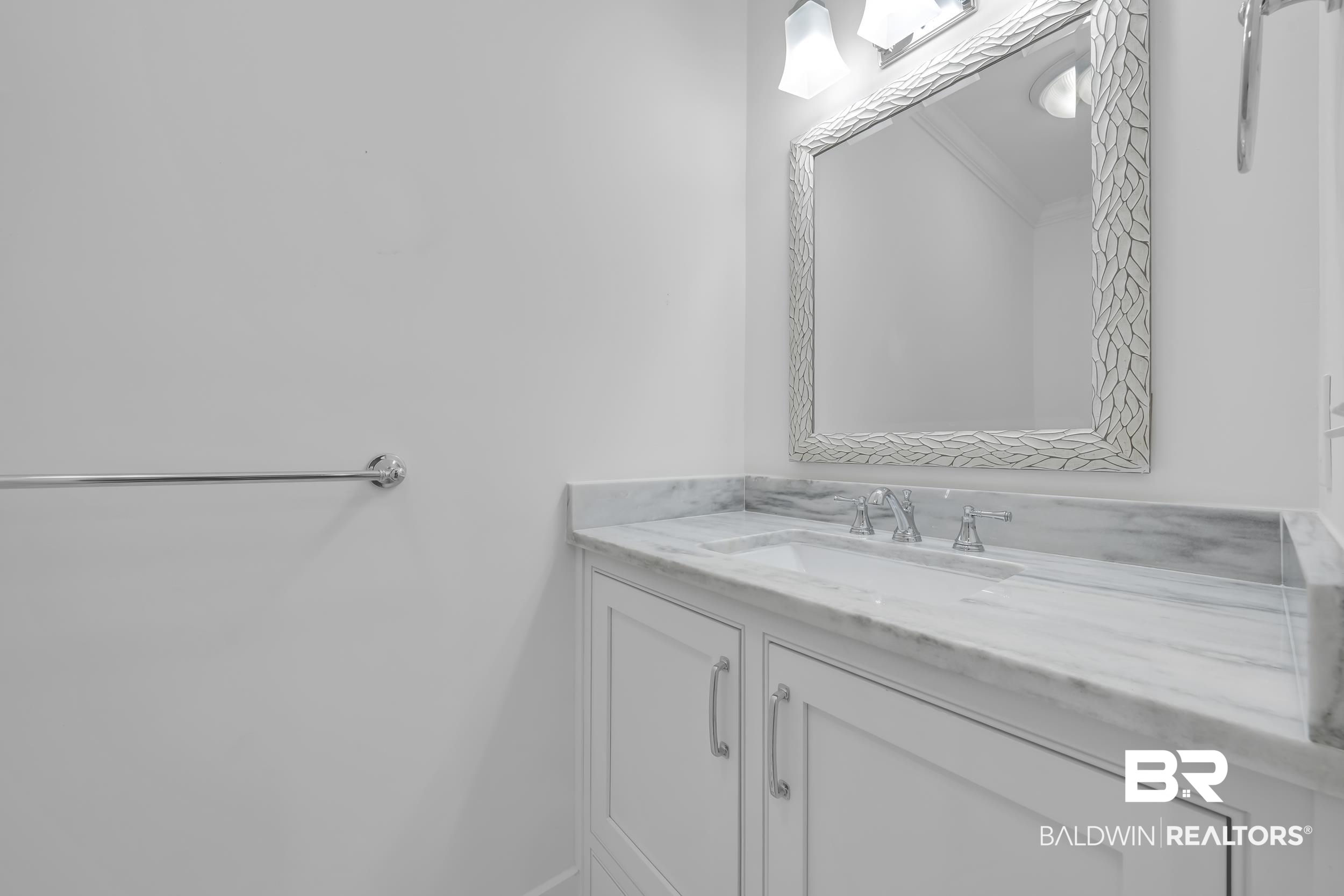 43199 Pine Grove Road Bay Minette, AL 36507 - Photo 52 of 71 Vanity featuring a stone countertop with integrated sink, chrome faucet, and white cabinetry