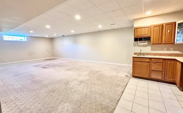 a view of a kitchen with a sink and a microwave