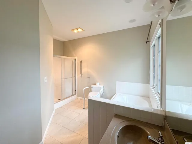 a living room with furniture and a walk in closet