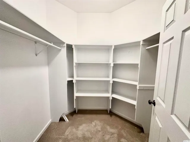 a view of an empty walk in closet