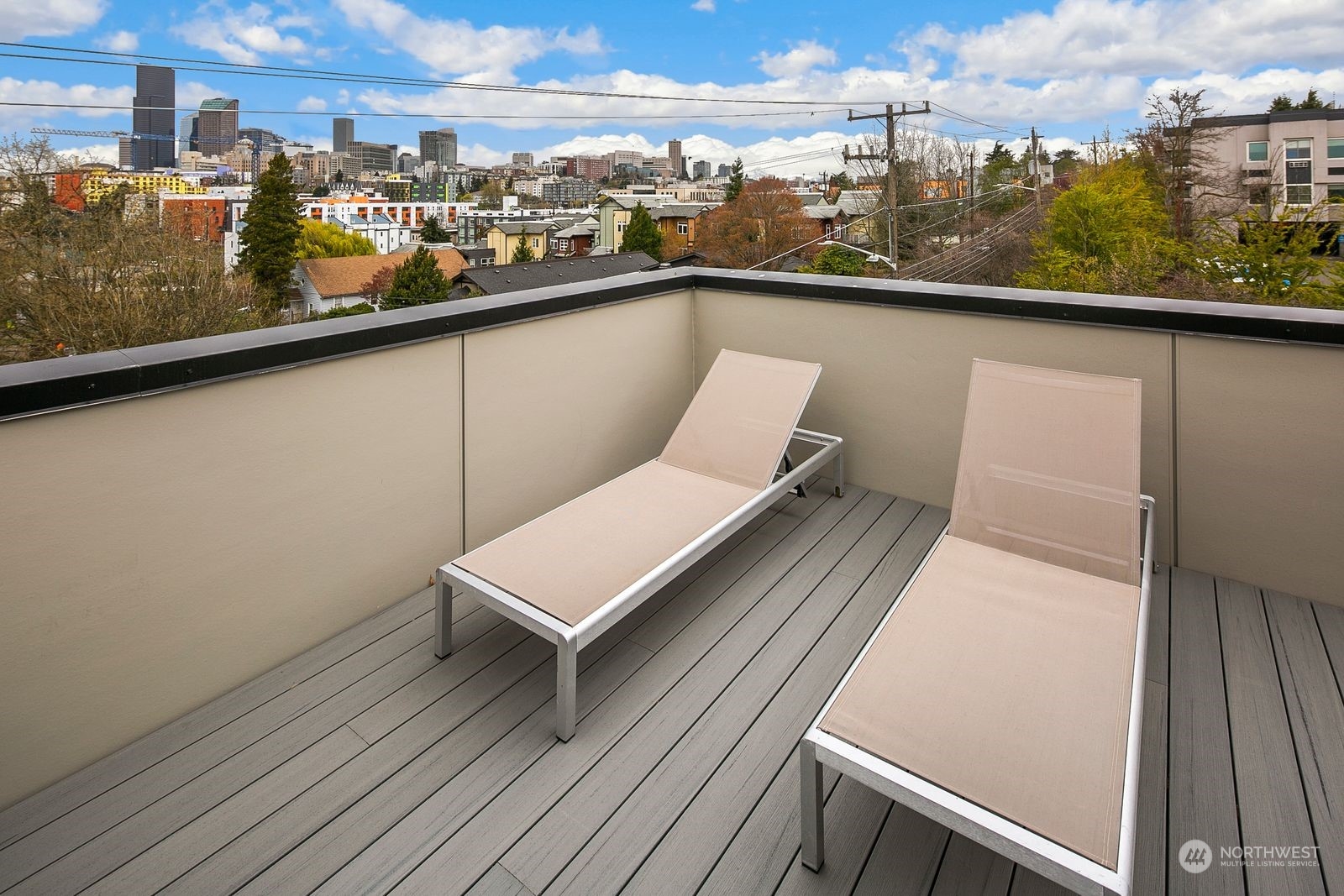 210 16th Avenue South Seattle, WA 98144 - Photo 14 of 17 a view of a balcony with wooden floor and city view