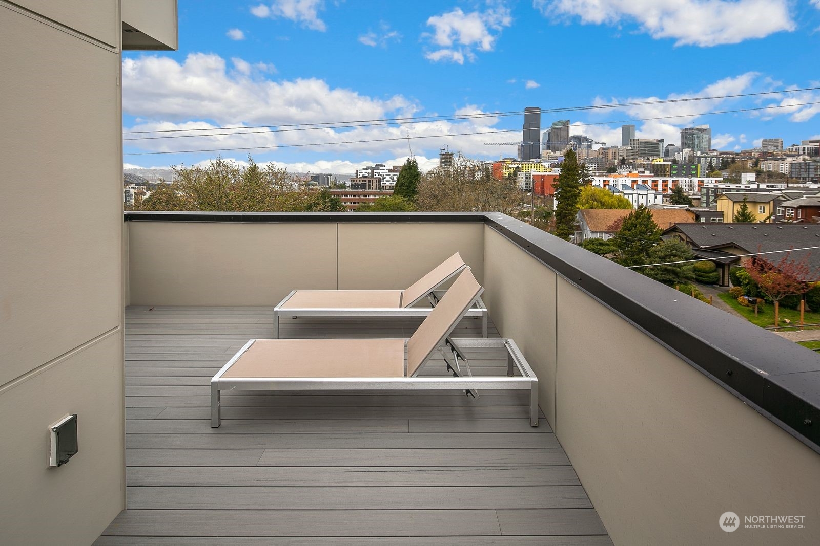 210 16th Avenue South Seattle, WA 98144 - Photo 15 of 17 a view of a balcony with wooden floor and city view