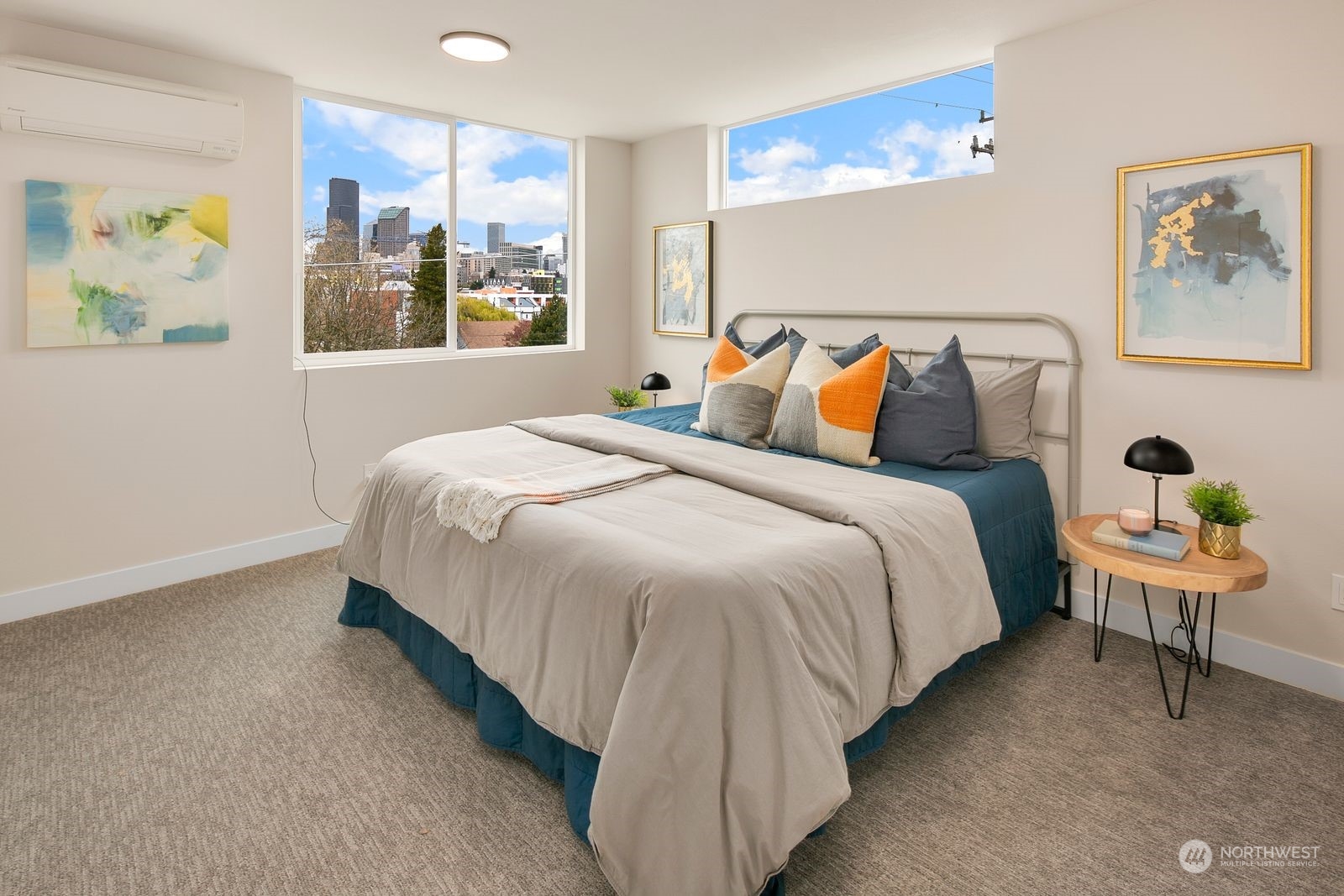 210 16th Avenue South Seattle, WA 98144 - Photo 9 of 17 a bed room with a bed and a painting on the wall