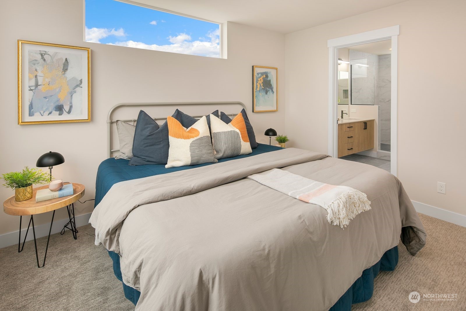 210 16th Avenue South Seattle, WA 98144 - Photo 10 of 17 a bedroom with bed and a painting on the wall