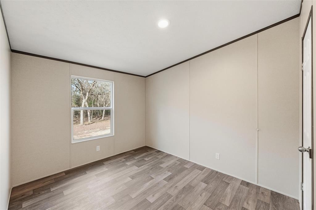279 Carlisle Court Springtown, TX 76082 - Photo 13 of 22 an empty room with a window