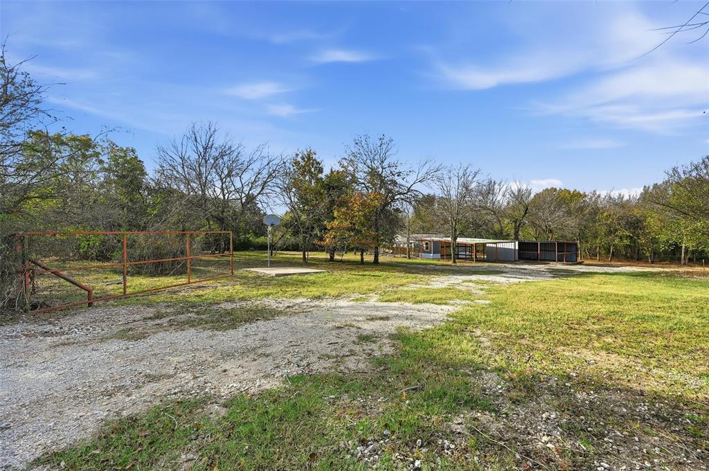 279 Carlisle Court Springtown, TX 76082 - Photo 18 of 22 a view of a playground with basketball court