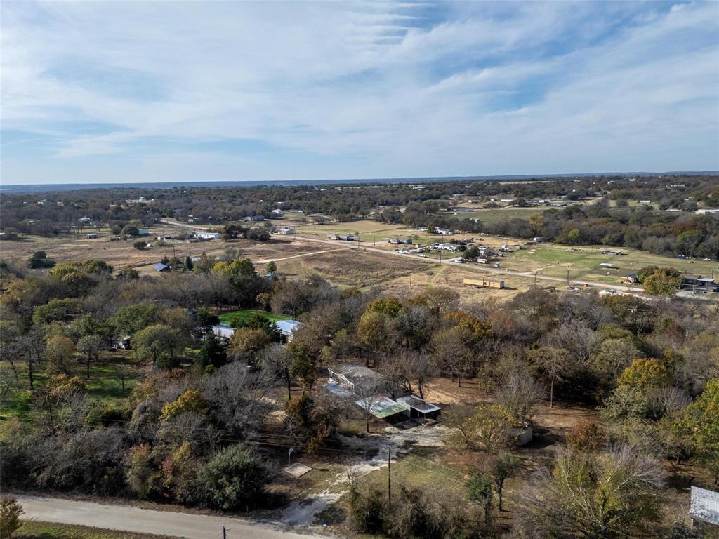 279 Carlisle Court Springtown, TX 76082 - Photo 19 of 22 an aerial view of residential building and trees