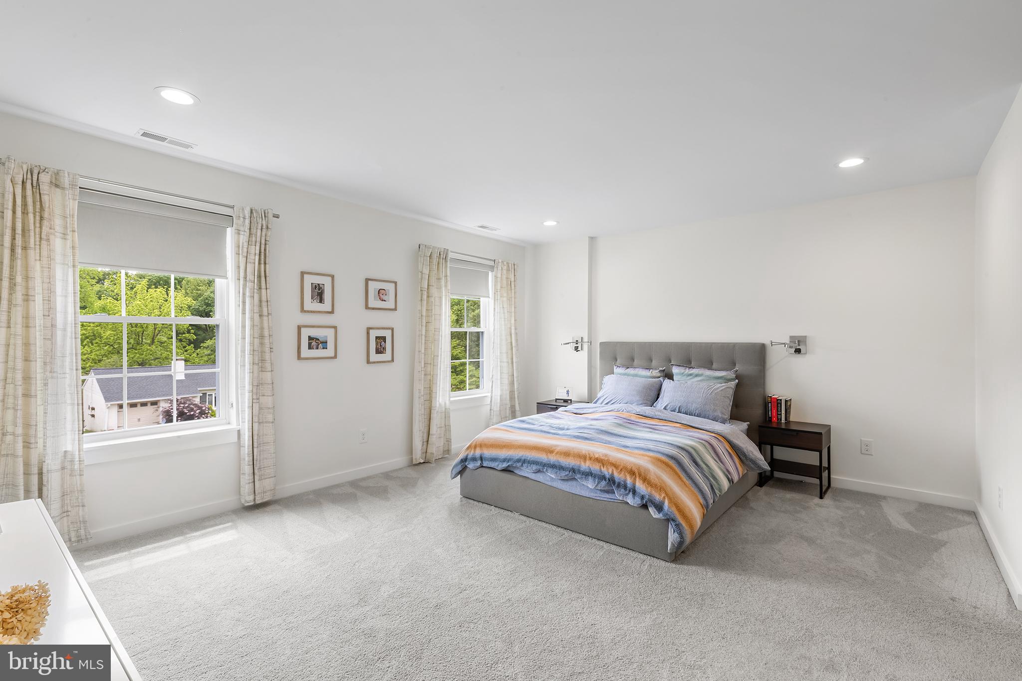 55 Dayleview Road Berwyn, PA 19312 - Photo 16 of 40 a spacious bedroom with a bed and a large window