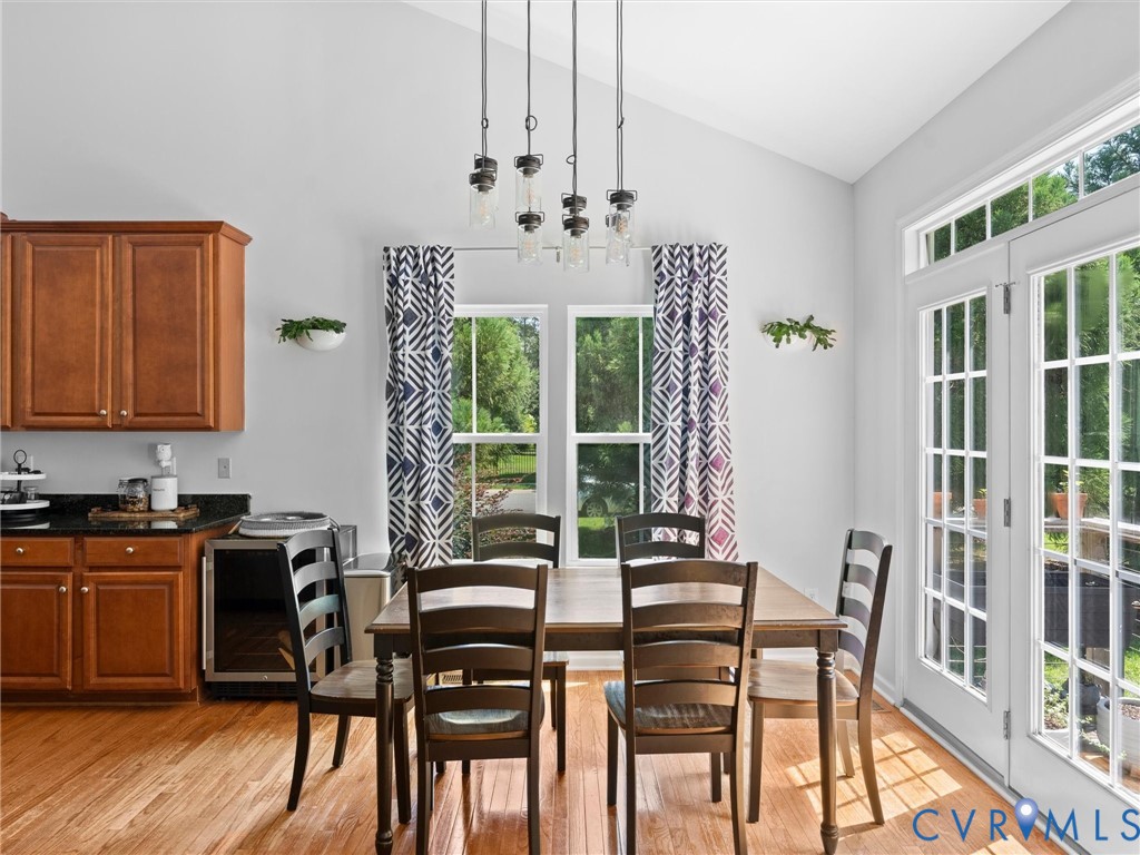 7434 South Franklins Way Quinton, VA 23141 - Photo 9 of 31 Dining area featuring vaulted ceilings, wood-finis
